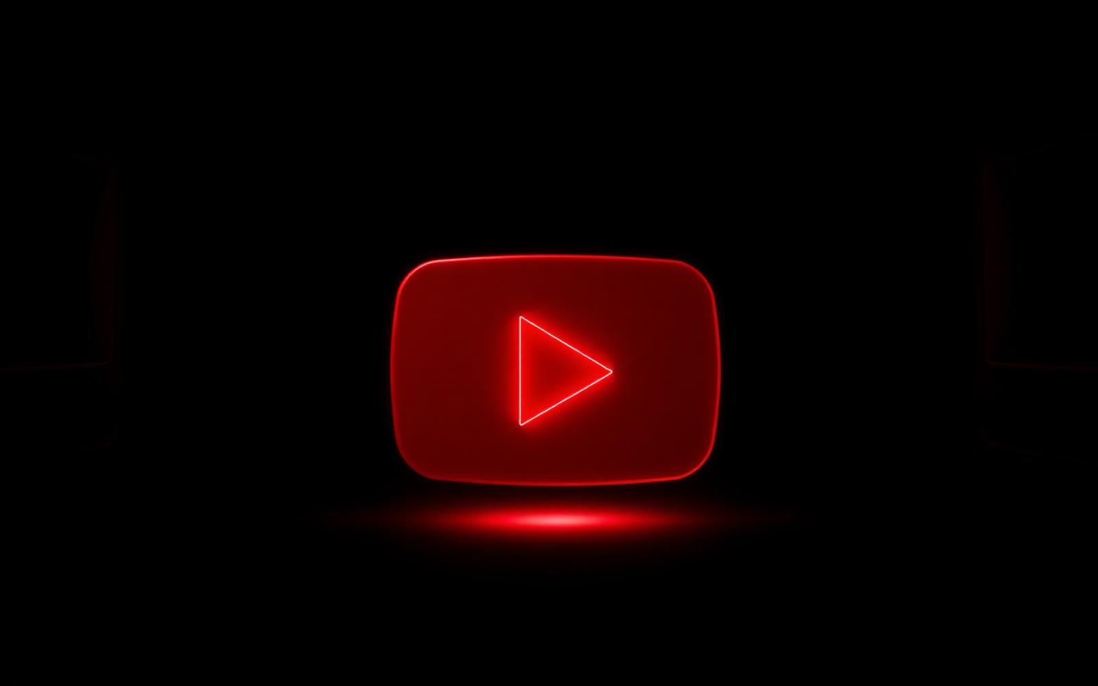 Glowing red play button representing YouTube creator tools
